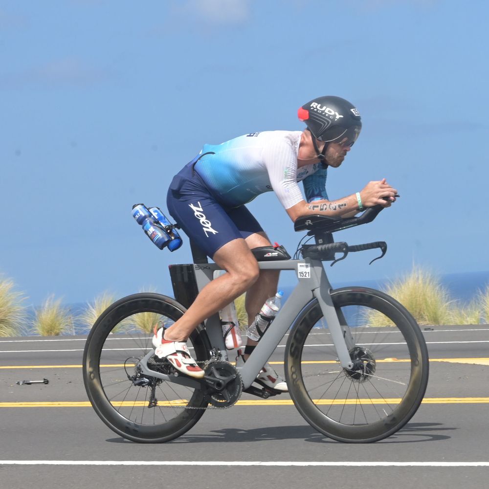 Ryan Falkenrath riding his triathlon bike on the Kona bike course